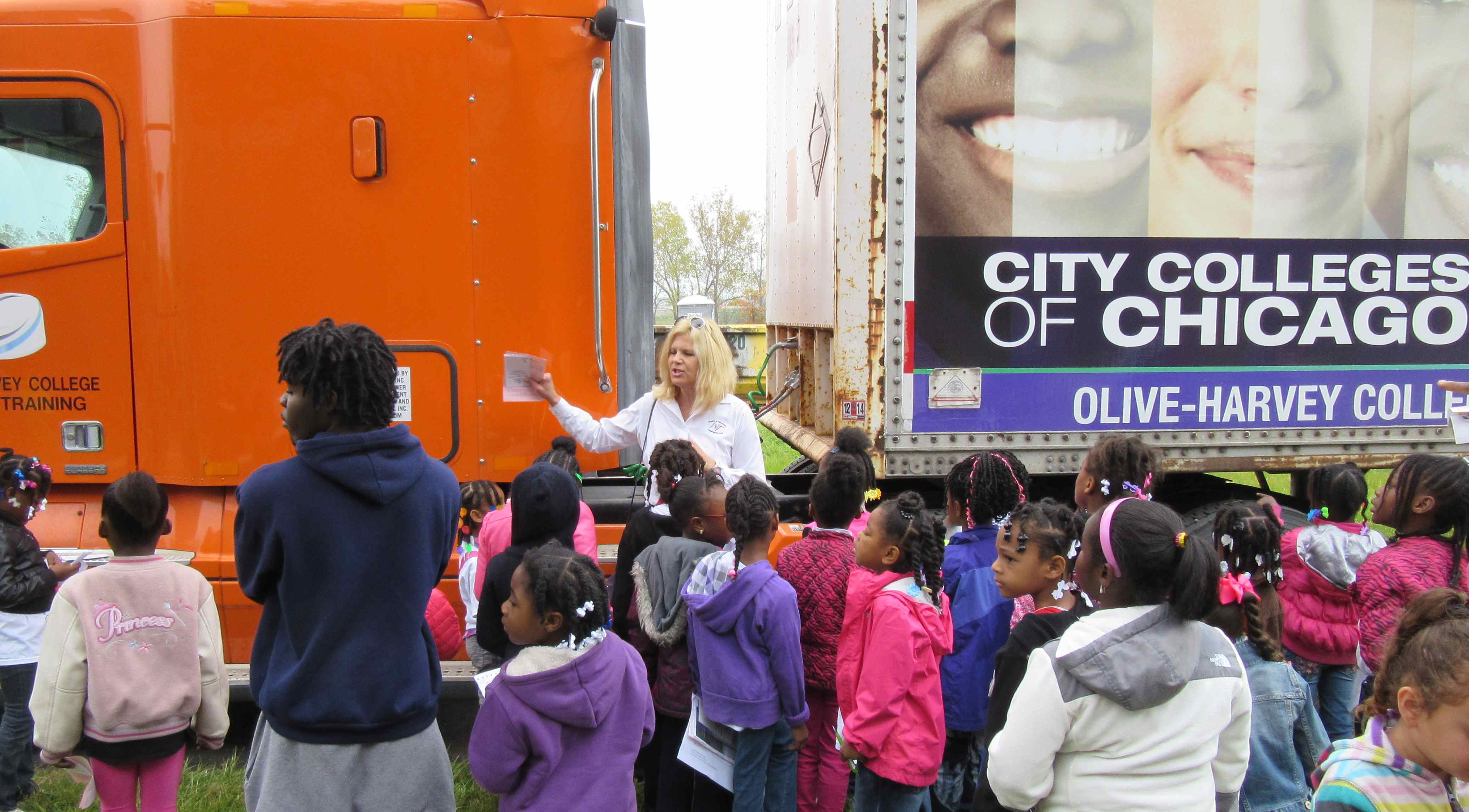 Women In Trucking President, Ellen Voie, teaches the Girl Scouts about careers in transportation.