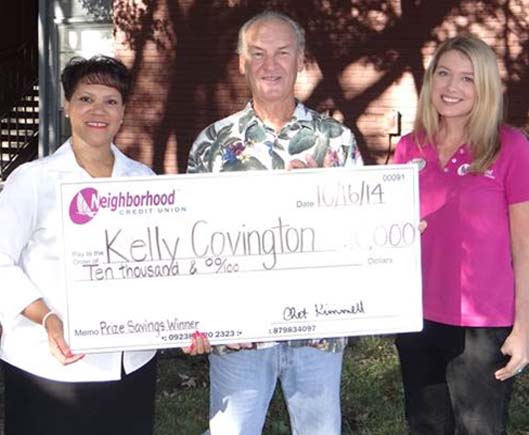 Neighborhood Credit Union leaders surprise Kelly Covington as their September $10K Prize Savings Winner.