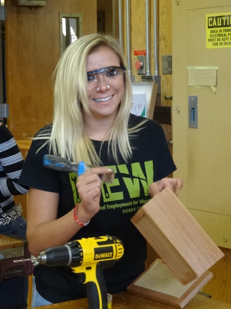 High school student shows the keepsake box she made during Sierra College Nontraditional Employment  for Women (NEW) event.