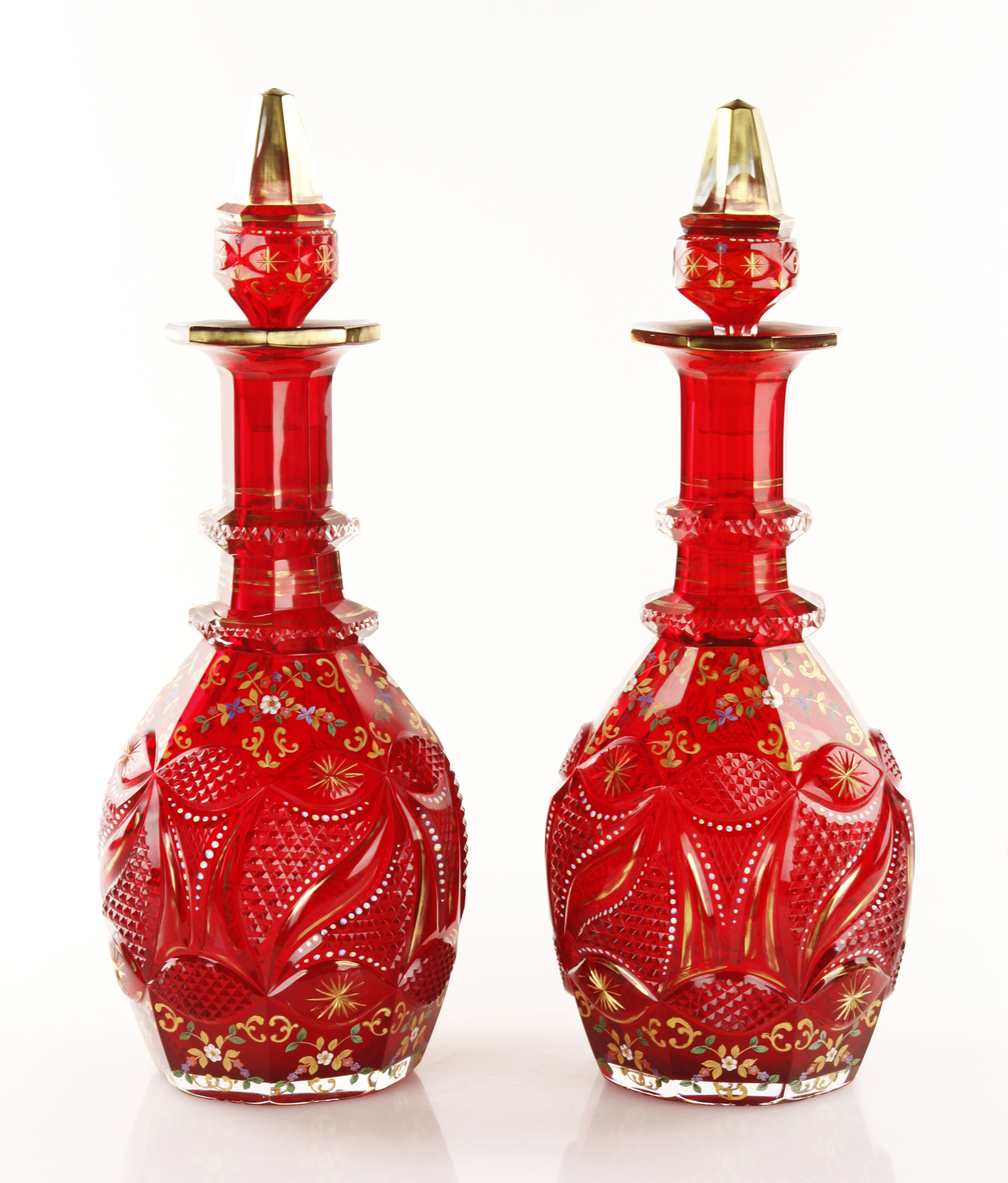 Pair of rare 19th century Bohemian glass decanters, ruby red cut glass, with gilt and enamel decoration, made for the Islamic market.