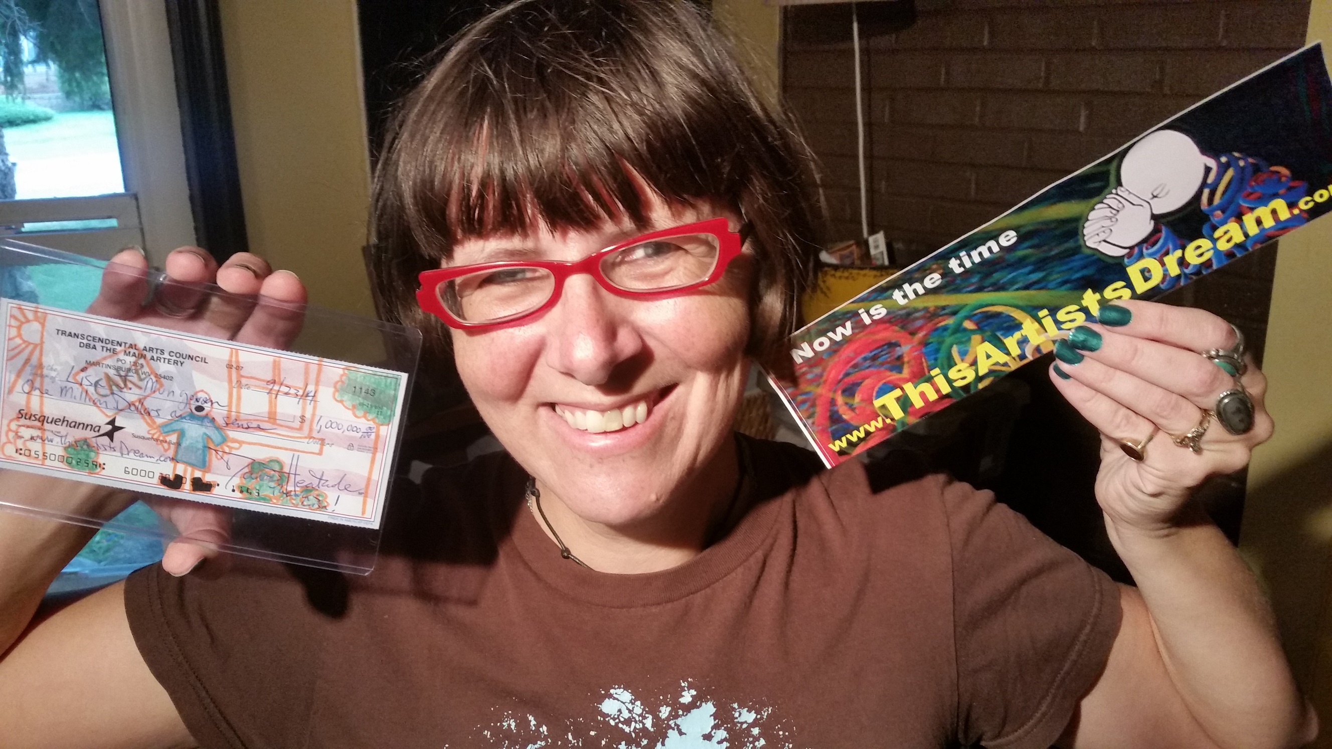 Lisa Mungovan, archivist at National Geographic seen with her Million Dollar "Art" check