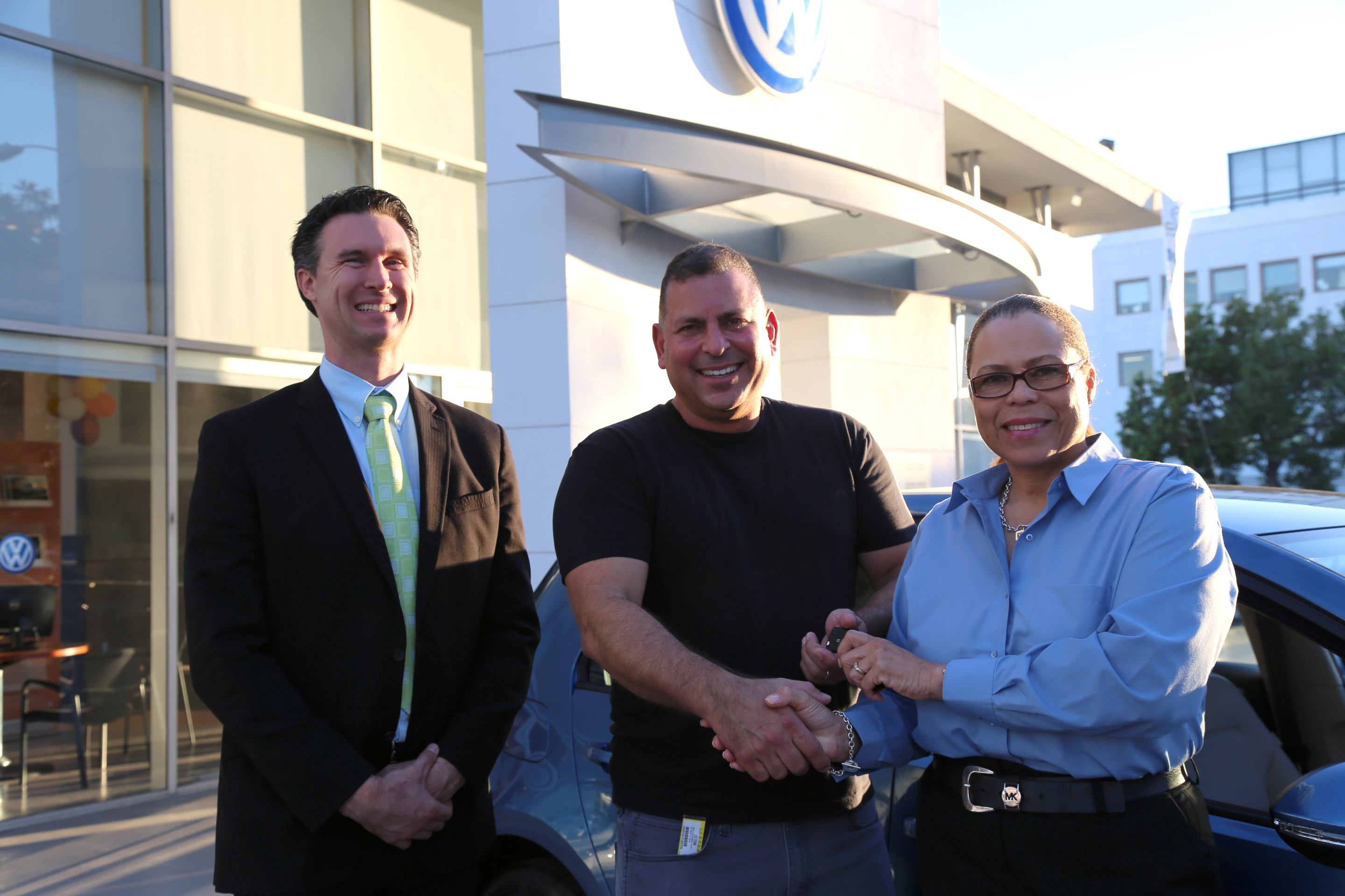 Volkswagen Santa Monica staff with new eGolf owner
