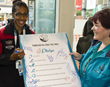 Papua New Guinea hurdler signs the Drug-Free Pledge at the 2014 Commonwealth Games.