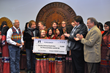 (L to R) Cherokee Nation Principal Chief Bill John Baker, Foreigner Bassist Jeff Pilson and Manager Phil Carson, and Deputy Chief S. Joe Crittenden congratulate the Cherokee National Youth Choir on winning $10,000 from the GRAMMY Foundation on Thursday, Nov. 13.