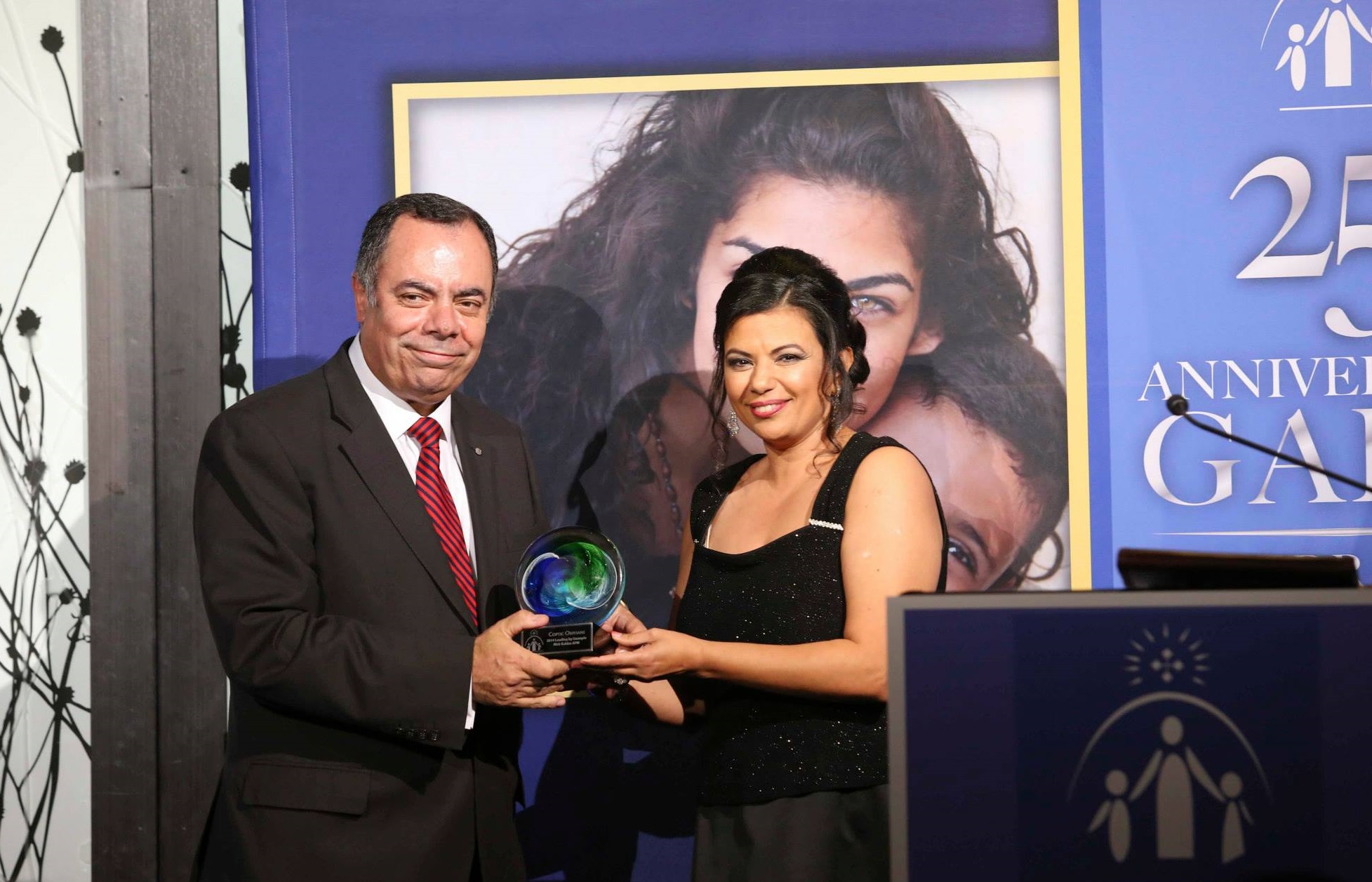 Nick Kaldas, APM, Deputy Commissioner of the NSW Police Force, receives Leading by Example Award from Coptic Orphans founder and Executive Director Nermien Riad in Lilyfield, NSW on Nov. 9, 2014