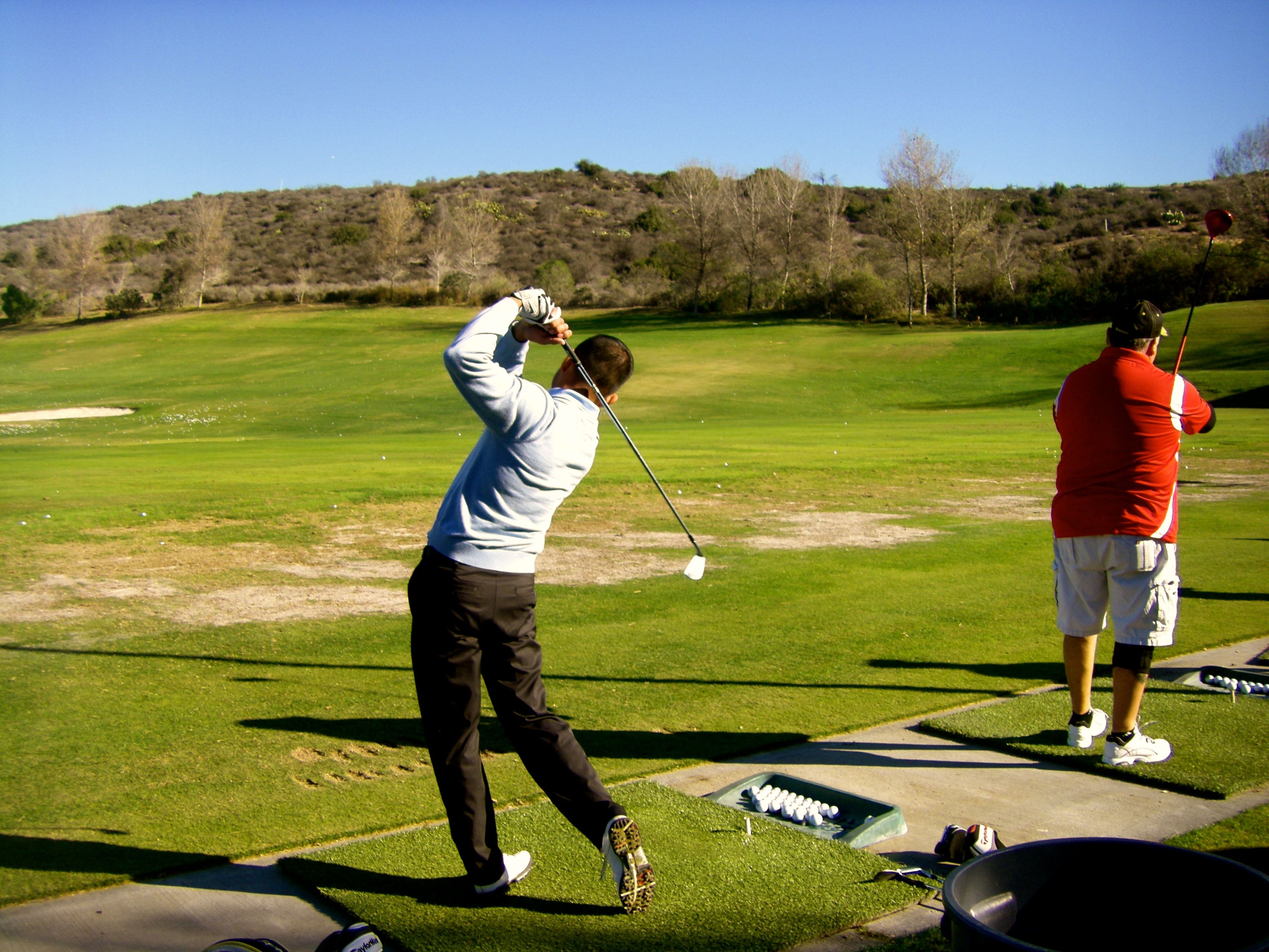 Naty Alvarado Jr. practices before teeing off at the Simple Green Golf Tournament to benefit the EGBAR Foundation.