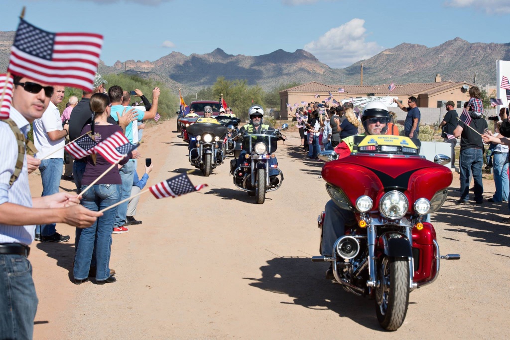 A motorcycle escort of U.S. veterans lead Sgt. Robert Bruce to his new home. More than 2,000 volunteer hours were donated by Taylor Morrison and its suppliers to help accomplish the task.