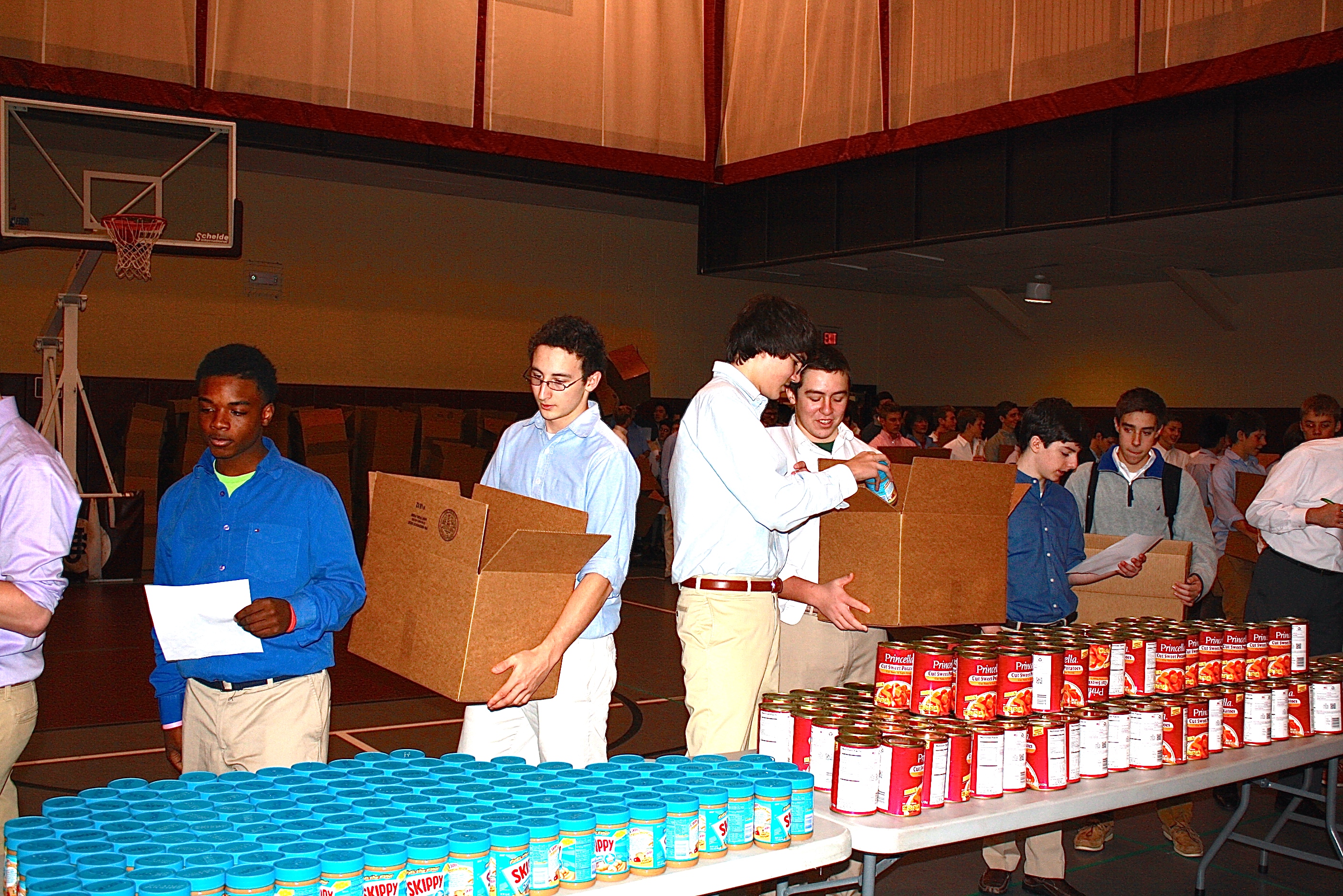 Students at Cleveland's University School packed Thanksgiving food boxes for 240 Cleveland families.