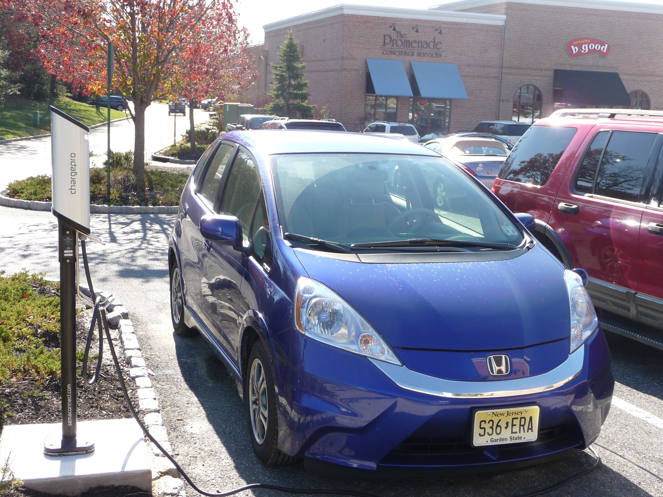A Honda Fit EV gets a recharge at a SemaConnect ChargePro Charging Station while its driver spends time shopping at the Promenade