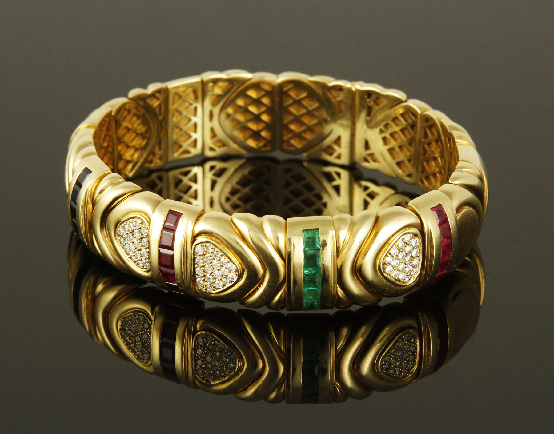 Bulgari 18K yellow gold, diamond, sapphire, ruby, and emerald bracelet