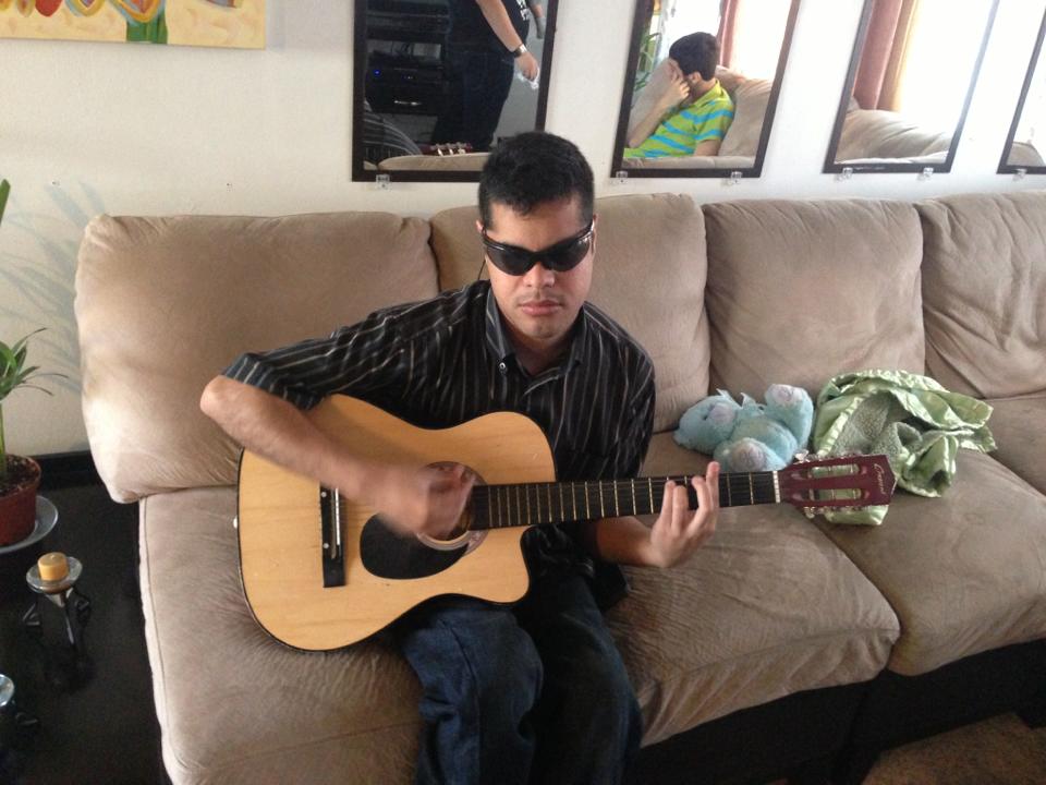Blind Musician Edgar Cabachuela Of Many Talents Playing One of Many Instruments and Singer