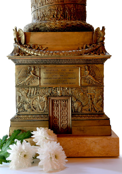 Base of antique bronze statue of the Colonne Vendome in Paris