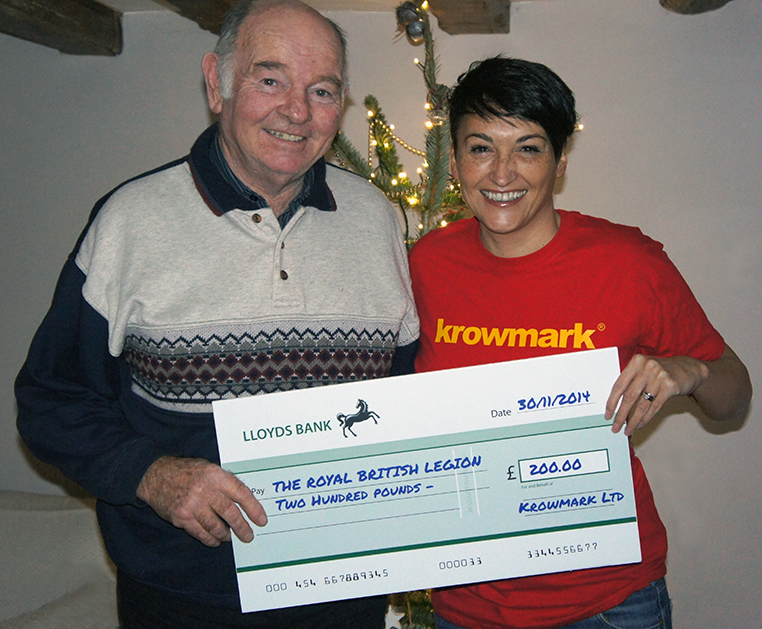 Krowmark's creative director Louise Catterall presenting Graham Tooley with a cheque for The Royal British Legion