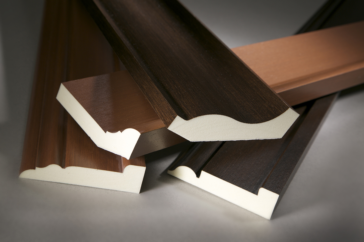 Classic Woodgrains selection of polyurethane mouldings with walnut and natural oak stains from Fypon.