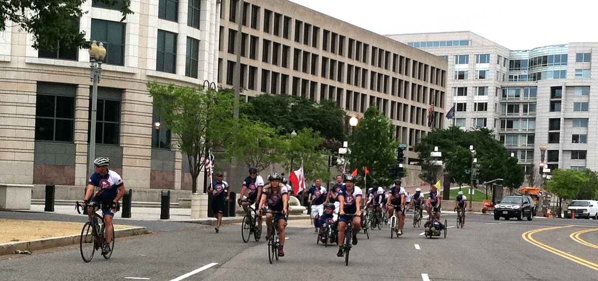 Team members ride through the empty streets of Washington, D.C. on July 4, 2014. MaryAnn Rosolino photograph.
