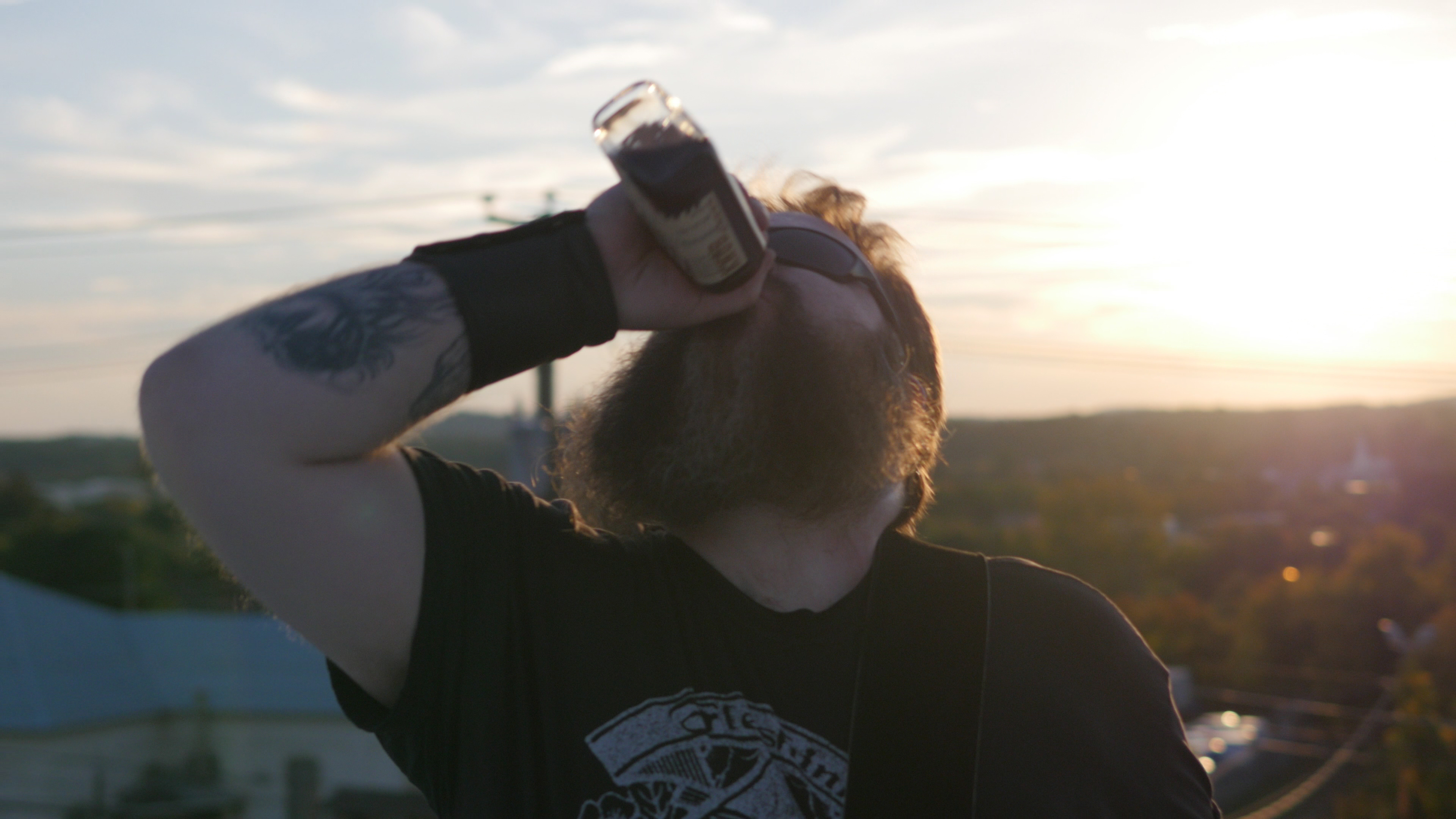 Guitarist/Tatoo Artist Dave McCormick drinking on set of Cruise Control Music Video.