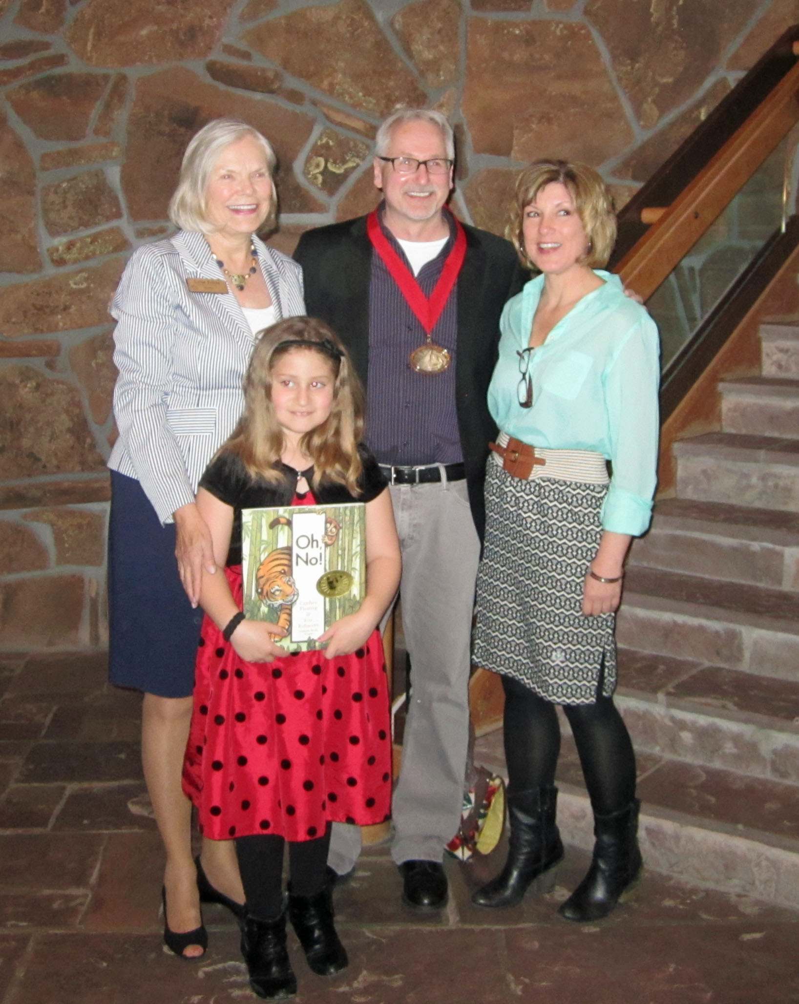 From left to right, author and National Museum of Wildlife Art Board of Trustees member, Lynn Friess with 2013 Bull-Bransom award winner, Eric Rohmann and author of the winning book, Candace Fleming.