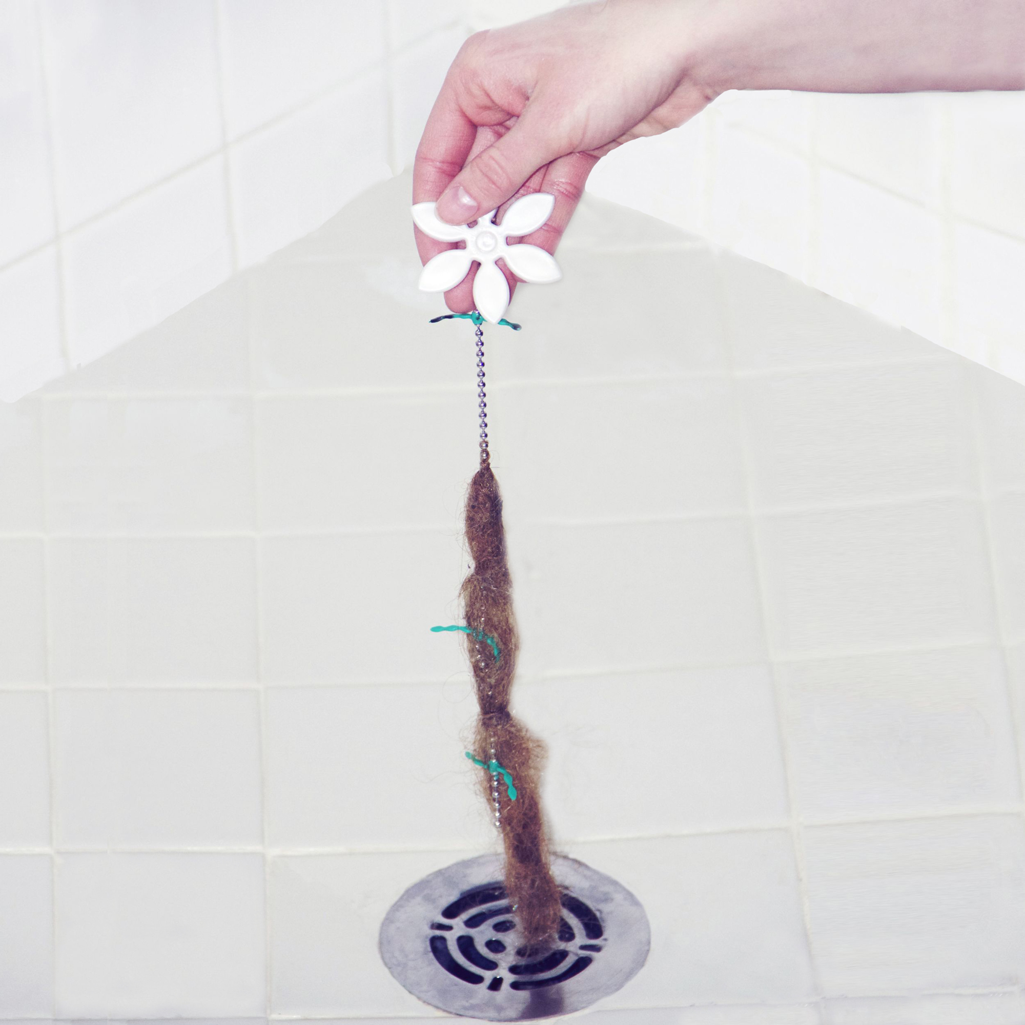 DrainWig eliminates the task of pulling wet, clogged hair out of the drain by hand.