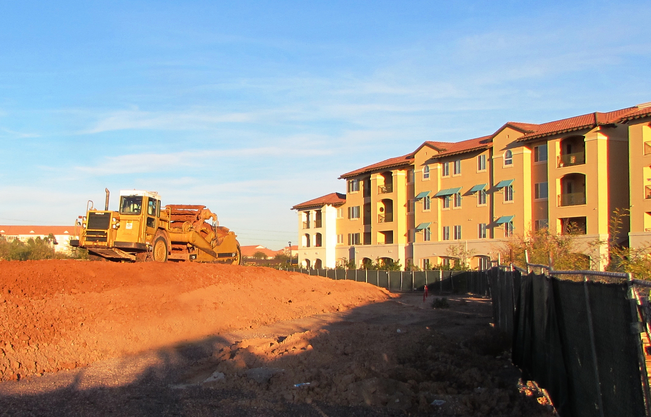 Moving dirt at The Colonnade to make way for two new 36-unit villas now under construction.