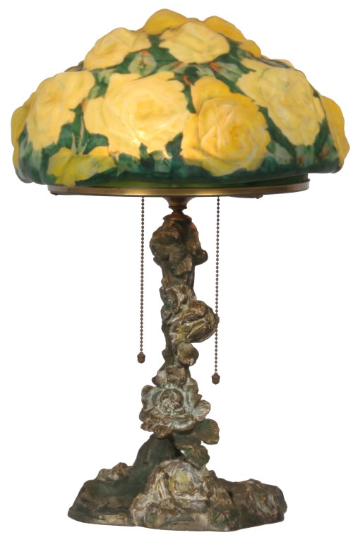 LOT 254 - Pairpoint Puffy Yellow Rose Table Lamp. 10 in. dia. domical puffy shade decorated with a bouquet of beautiful yellow roses on a green background; shade has a few minor chips along the bottom