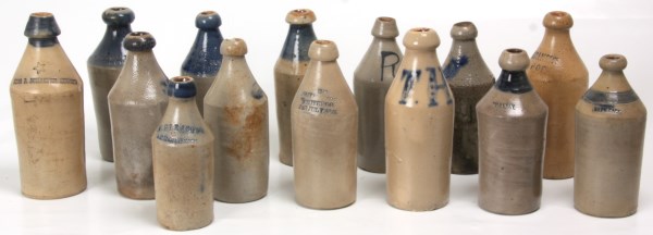 LOT 91 - Lot of 14 Stoneware Bottles. Some decorated with cobalt, approximately 10in. to 12 in. high, in good overall condition. Marked Brownell Wheaton & Co. 1856, Walker's Pop, Chas. P. Schaefer Reg