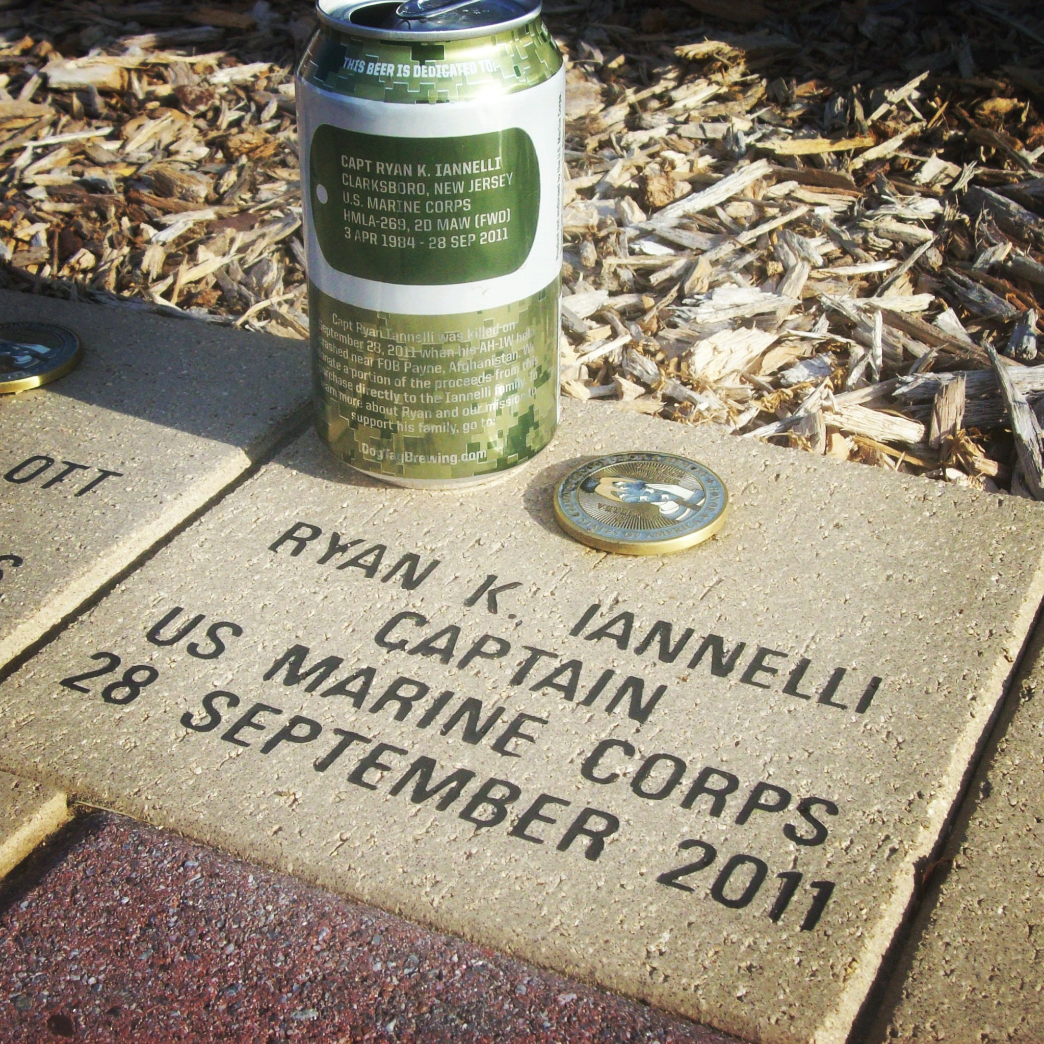 Ryan's tribute can next to his memorial stone in Mt. Olive, NJ.
