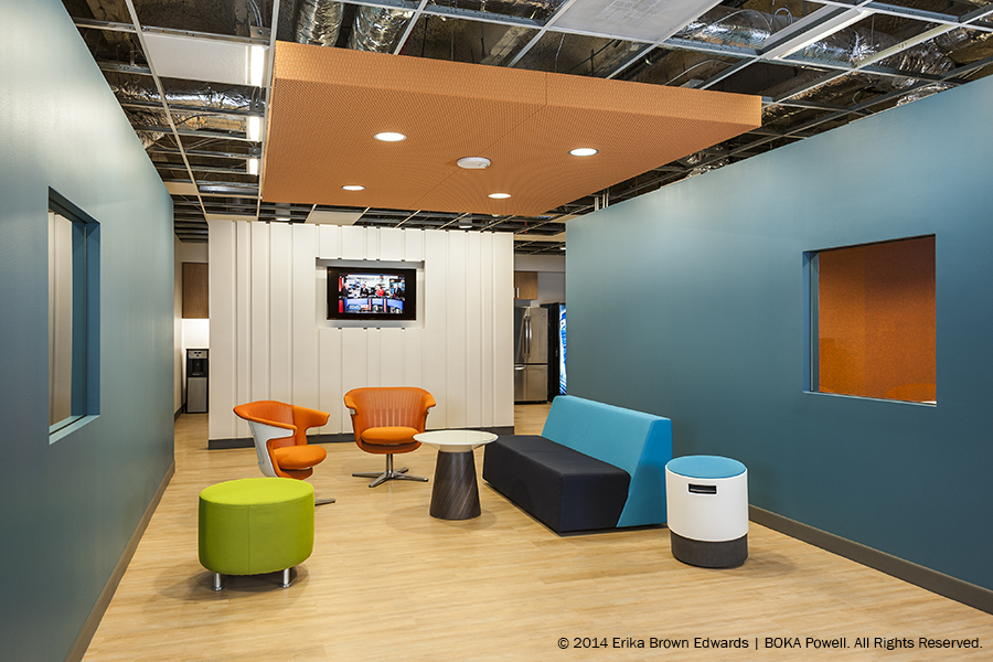 Lanyon's new workspace includes cushioned cubbies with storage, walking desks with built-in treadmills and informal huddle spaces for team meetings.