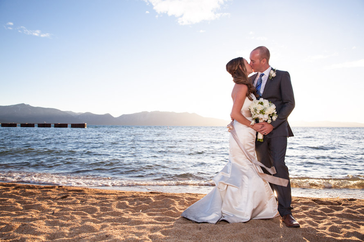 Bride and groom enjoy sandy Lakeside Beach adjacent to The Landing Resort & Spa – a perfect venue for romantic “first look” photos (Photo by Indigo Photography).