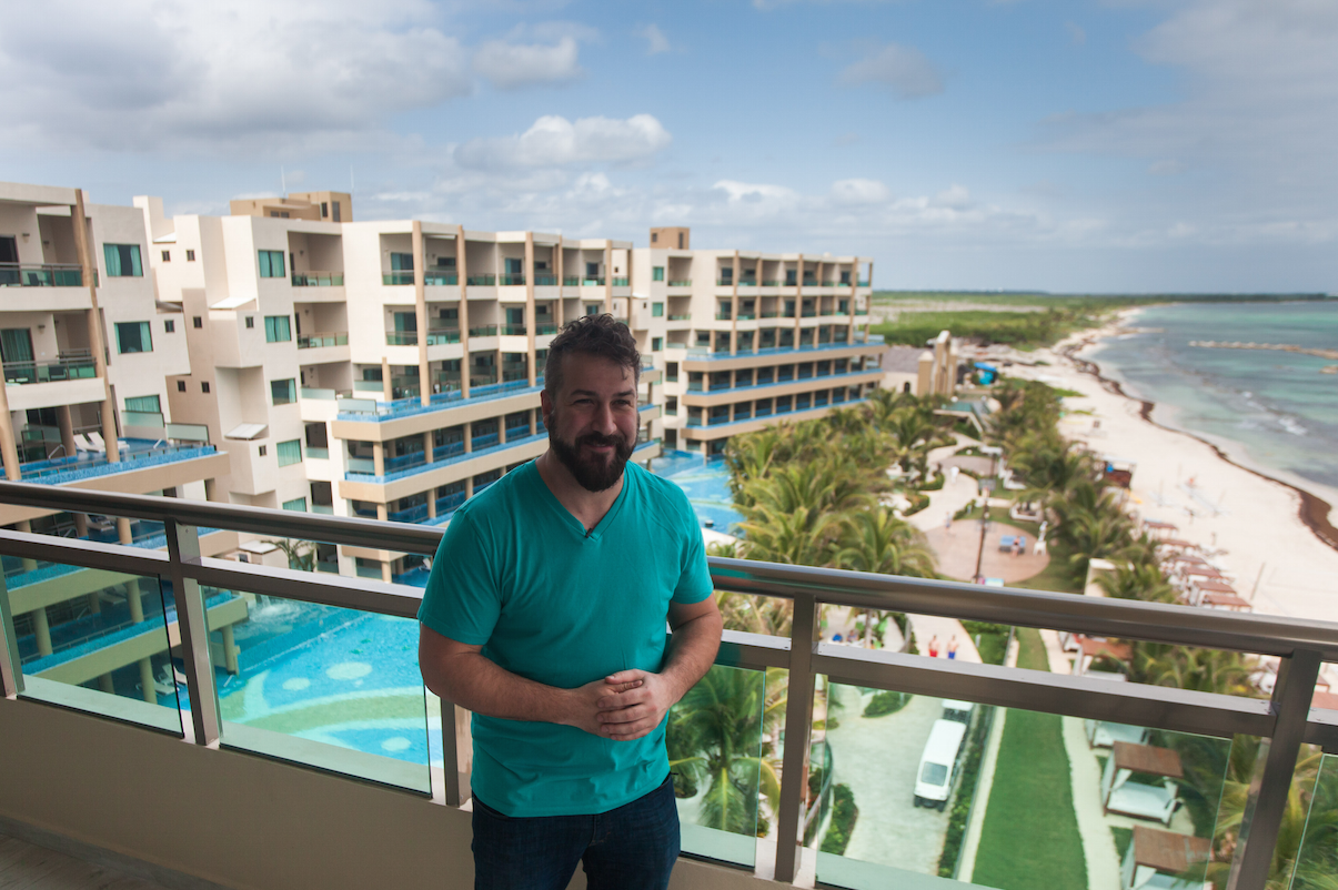 Joey Fatone on the balcony of his infinity pool suite overlooking Generations Riviera Maya, by Karisma