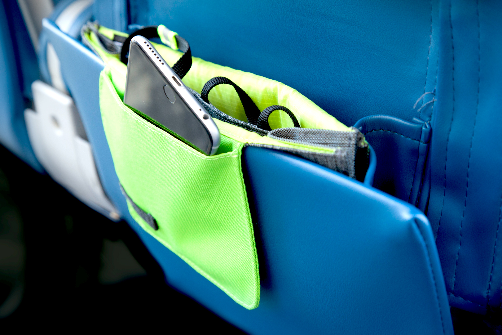SmartFlap ™ fastens to seat pocket and carry's small items