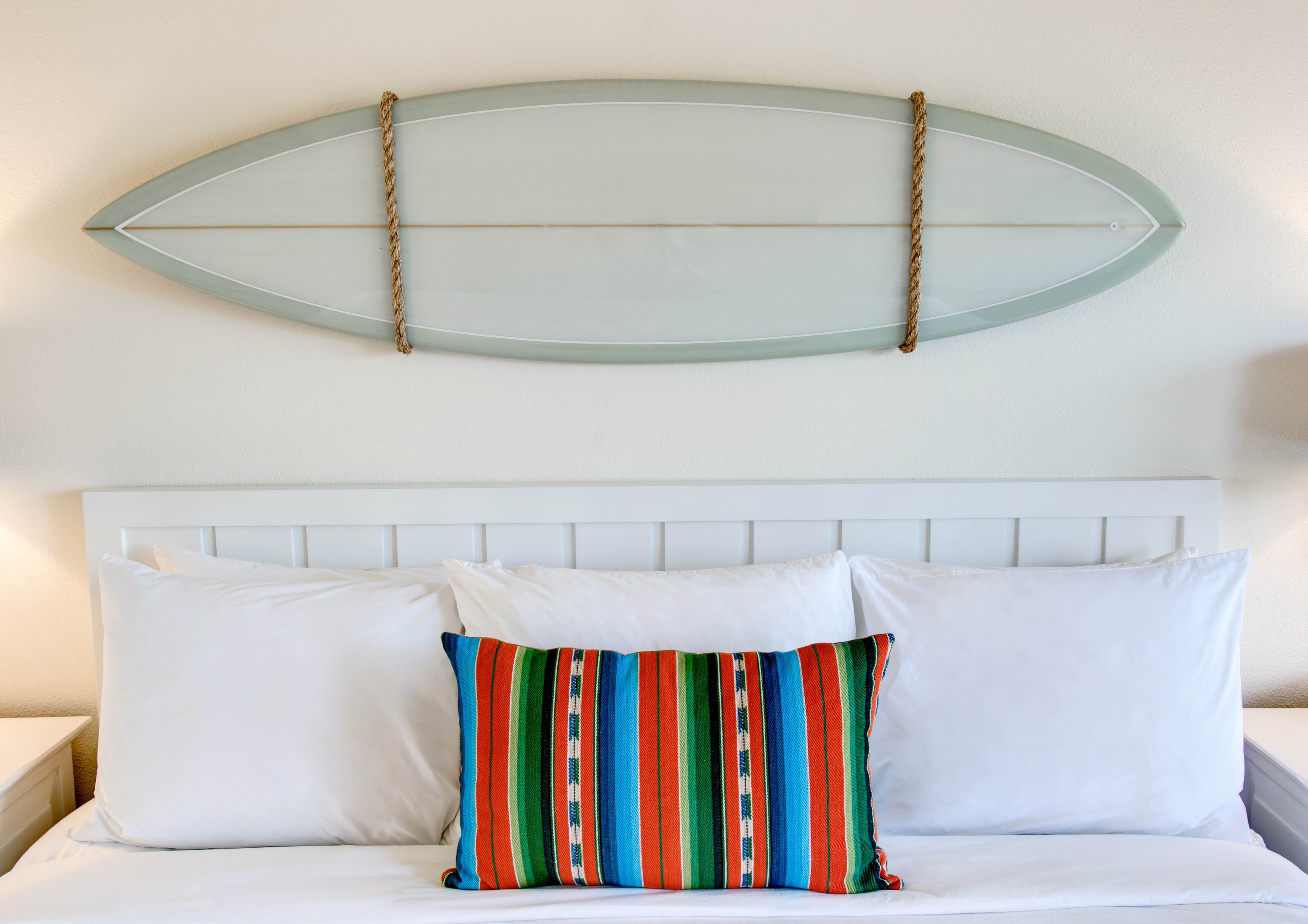 Custom-made surfboards hang over the beds at Laguna Beach House