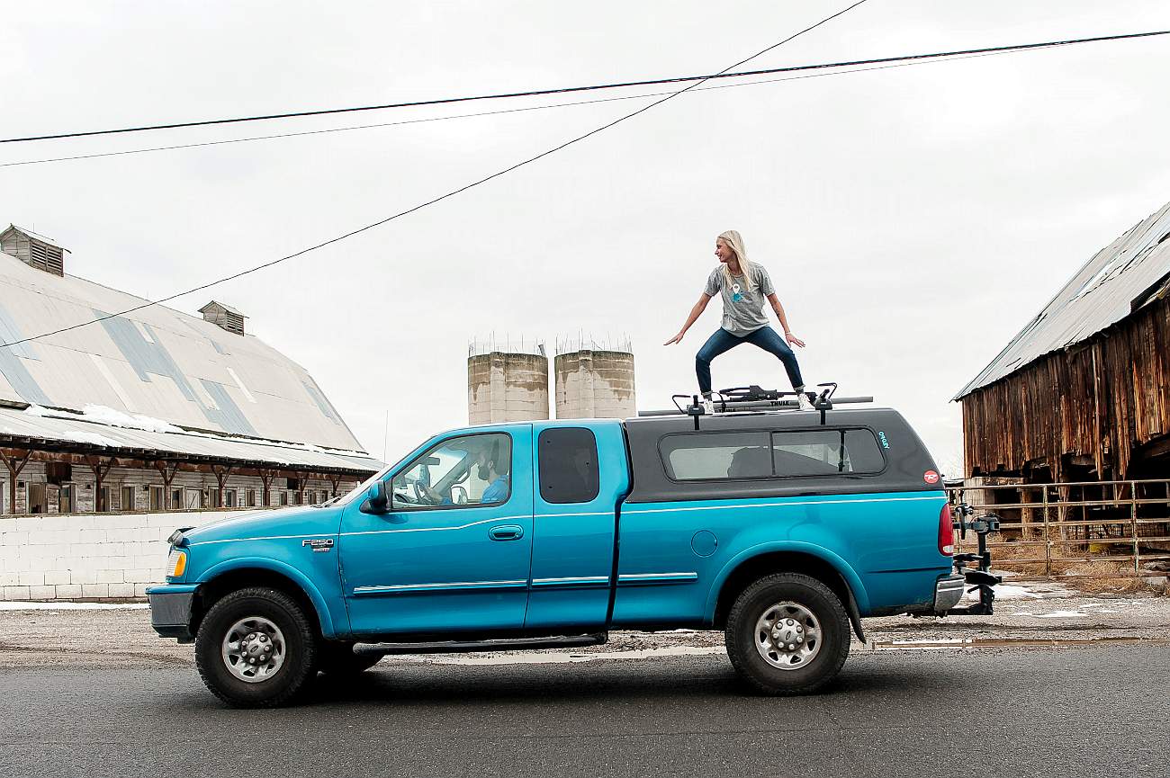 Surf on top of a car going at least 5 mph