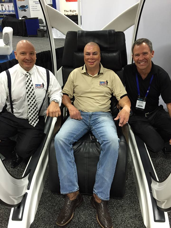 From Left Dr. Tim Novelli, Staff Seargent (ret) Shilo Harris (seated in the Magnesphere) and Allen Braswell President, Magneceutical Health at Booth, Parkers Chiropractic Symposium, Las Vegas