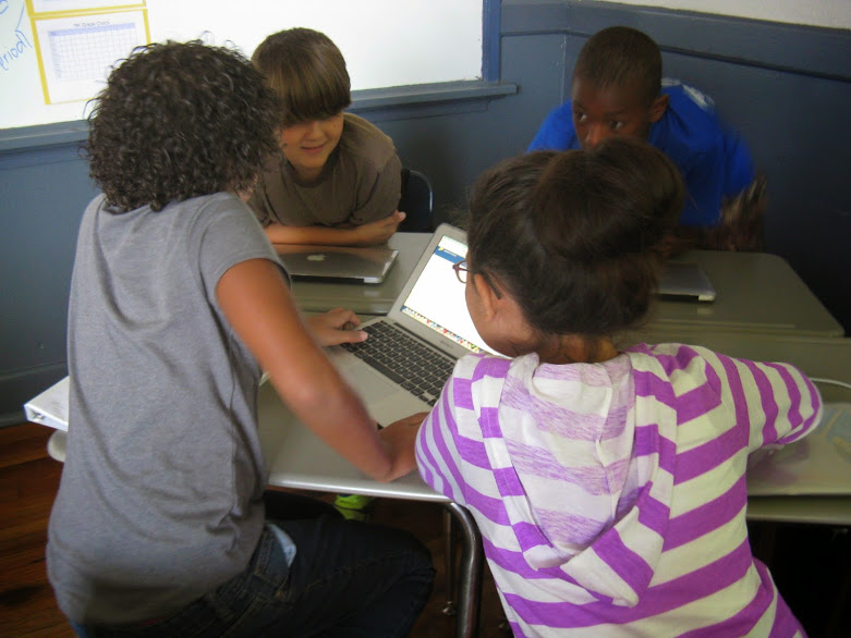 Students collaborate in a blended learning classroom