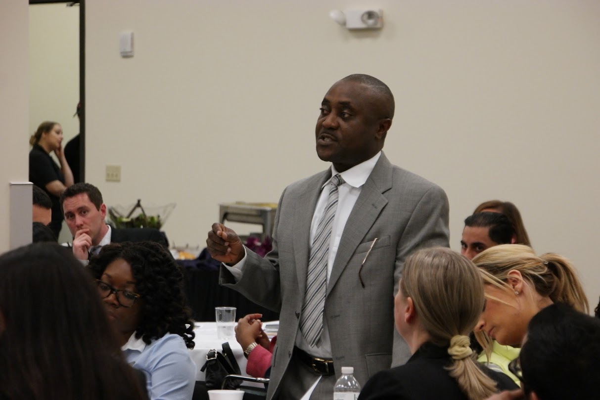 Cooley Law School Student Asks Guest Speakers Questions Durring An Open Forum Discussion