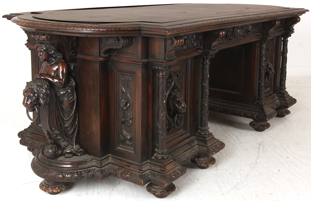Lot 126: An expected star lot of the furniture category is this walnut marble-top partner's desk and chair.