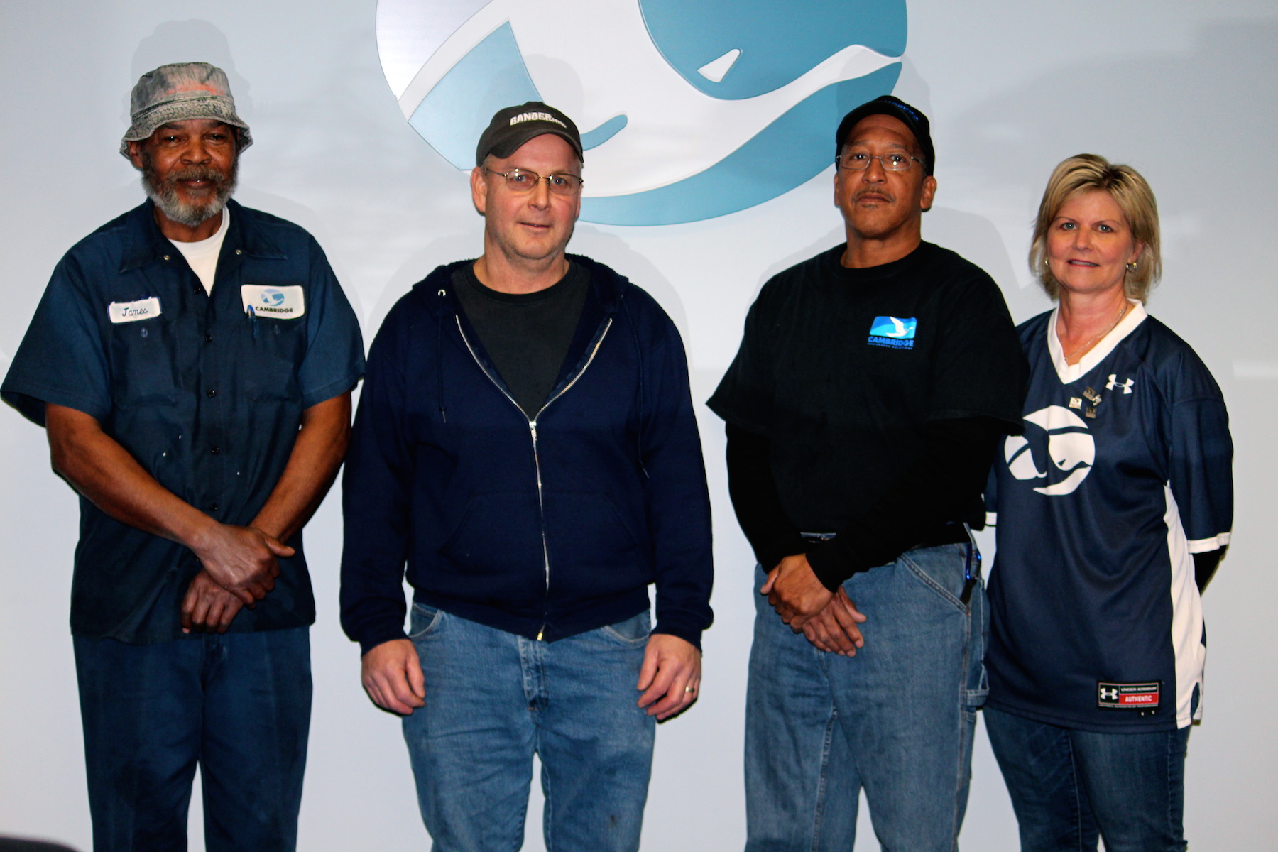 Cambridge International 20-year employees:  (L to R) James Travers and Johnny McGlaughlin of Cambridge, MD and George Johnson, Mardela Springs, MD, are congratulated by CEO Tracy Tyler.