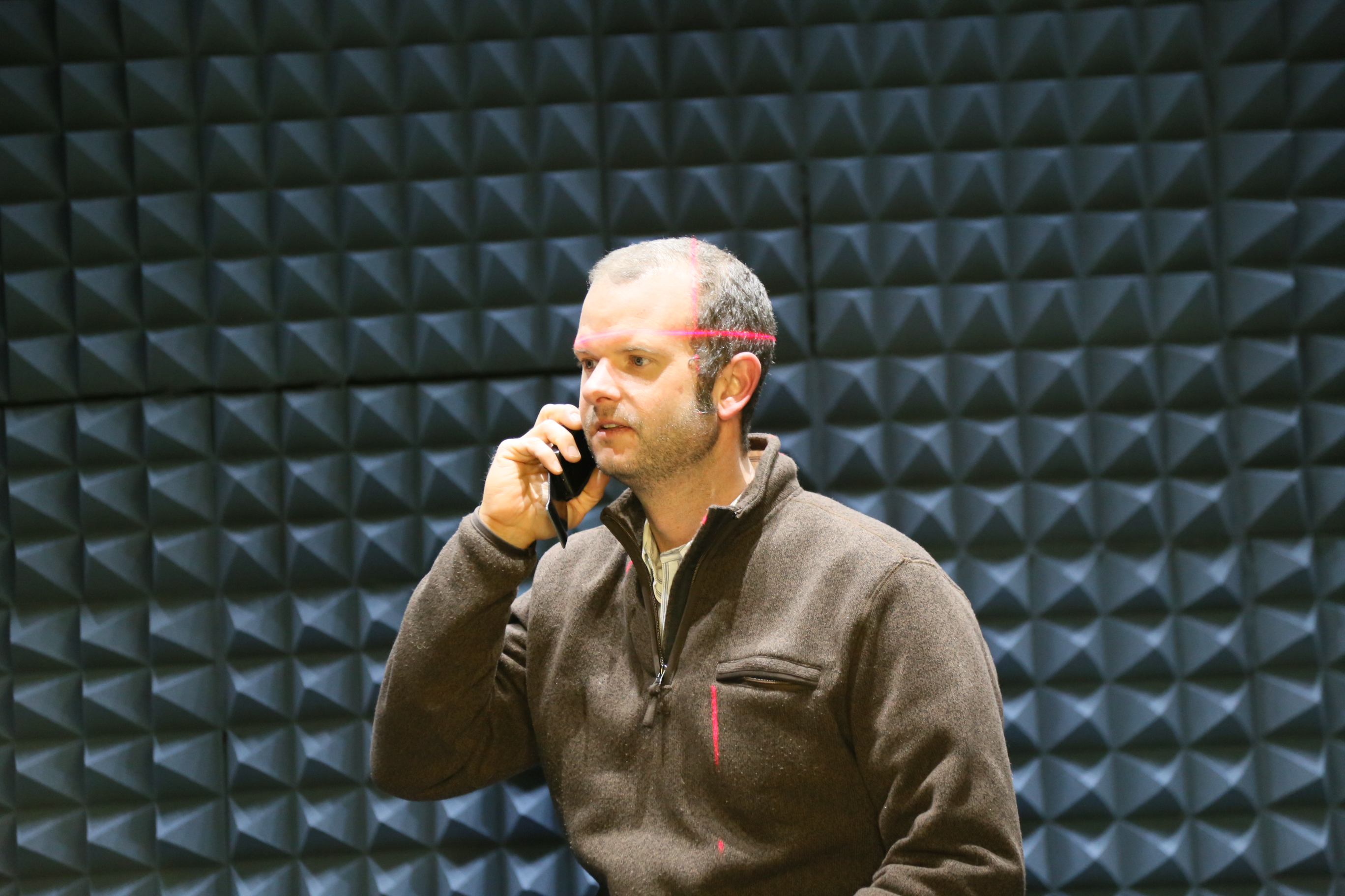 BluFlux founder and president Ben Wilmhoff testing the prototype of the patented cellphone case in the company's testing chamber