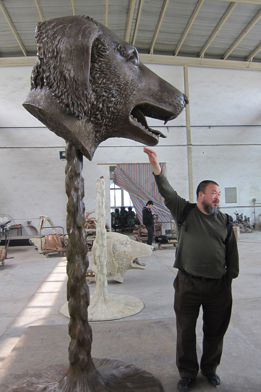 Chinese artist Ai Weiwei with the Dog sculpture (standing at roughly 10 feet tall) from the Zodiac Heads exhibition that will open in Jackson Hole in May.
