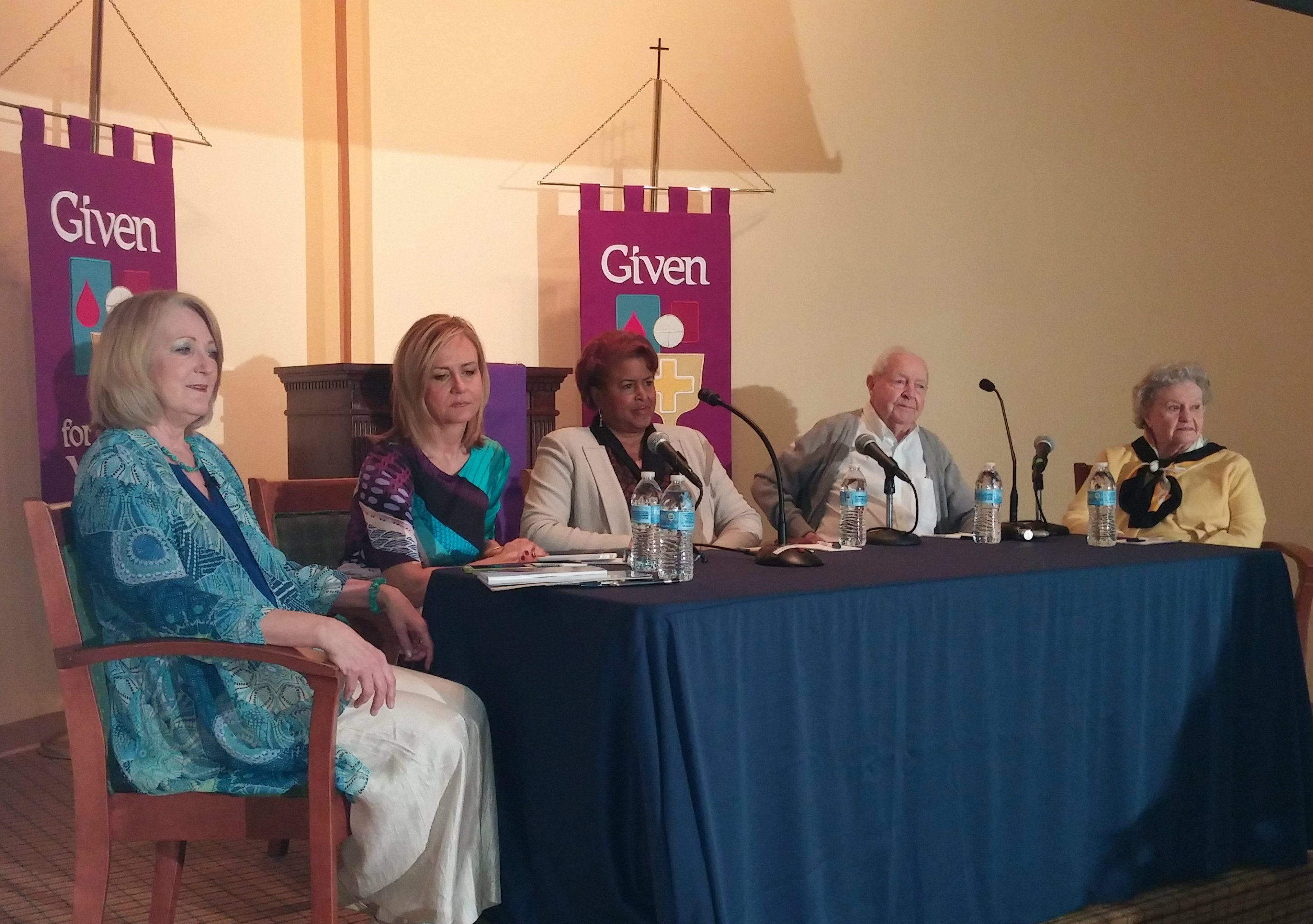 Buchanan (left) leads a panel discussion on issues of aging with Jane McGarry, Dorothy Roberts, Ed Gray, and Ann Holmes.