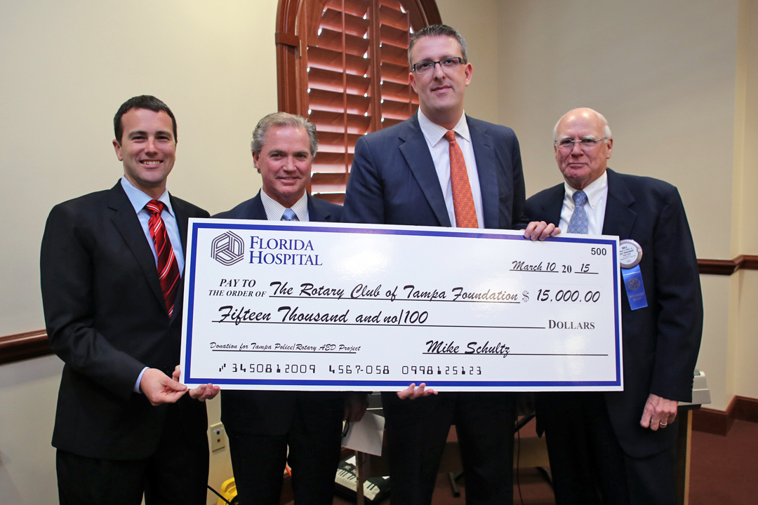 Florida Hospital Tampa's President Brian Adams presents donation to Rotary Club of Tampa
