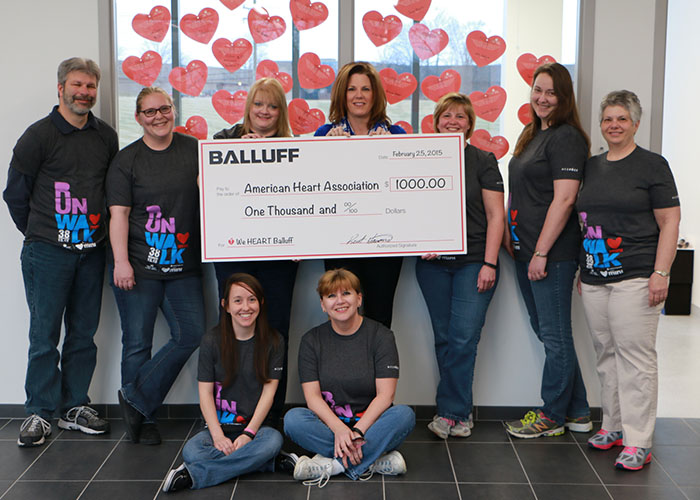 The Balluff Heart Mini Team displaying the $1000 donation check from Balluff's President Kent Howard.