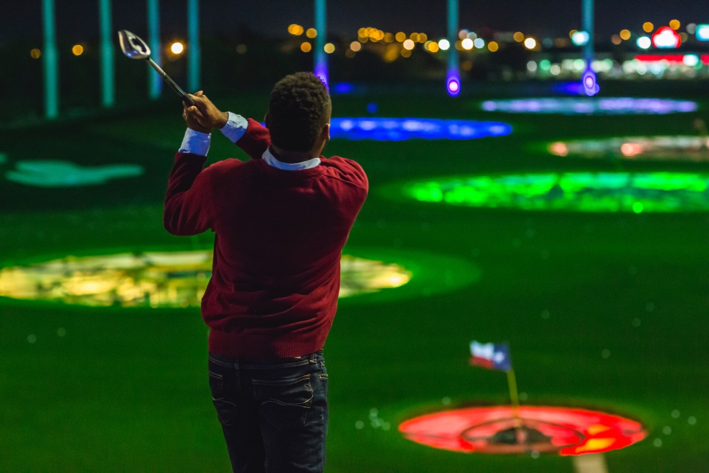 Golfer swings at Topgolf