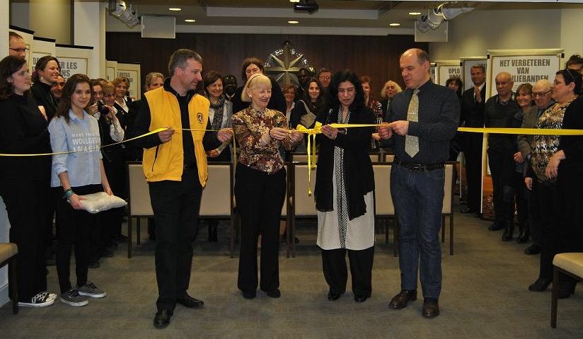 Cutting the ribbon at the Volunteer Ministers exhibition February 26, 2015, at the World Civil Defense Day exhibit and open house at the Brussels Branch of the Churches of Scientology for Europe.