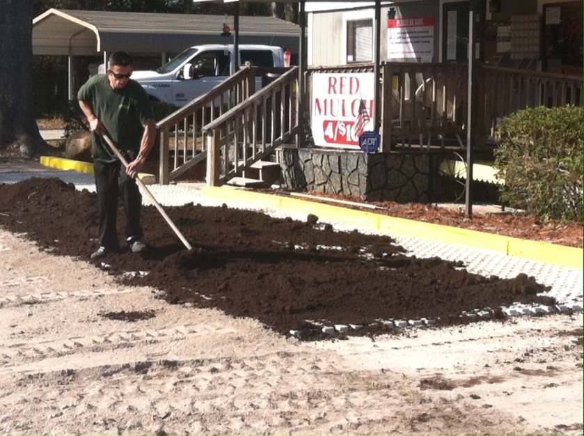 Spreading Soil3 Organic Compost over Drivable Grass pavers at Super-Sod of Jacksonville, FL