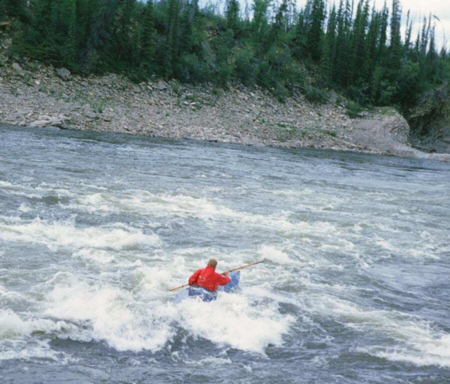 Fred paddles the Peel River
