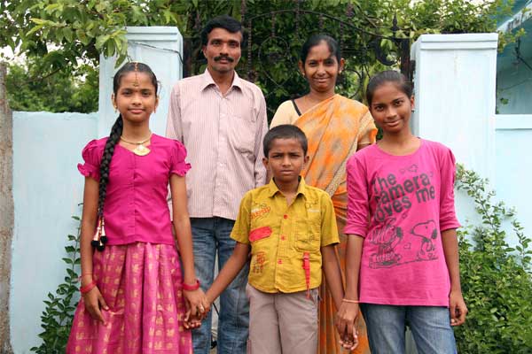 Shruthi (left) and her siblings, Vinay and Sony, pose for a picture with their parents, Venkat and Shoba in India.