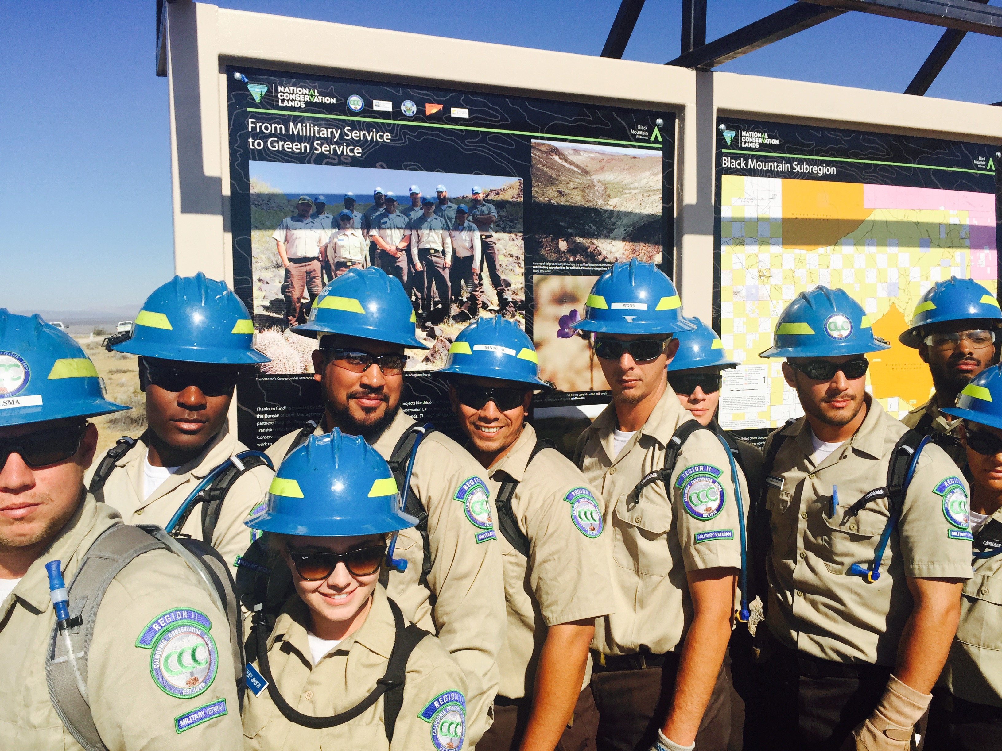 Members of the California Conservation Corps—all military veterans—stand in front of a new Black Mountain Wilderness sign. Photo courtesy of Conservation Lands