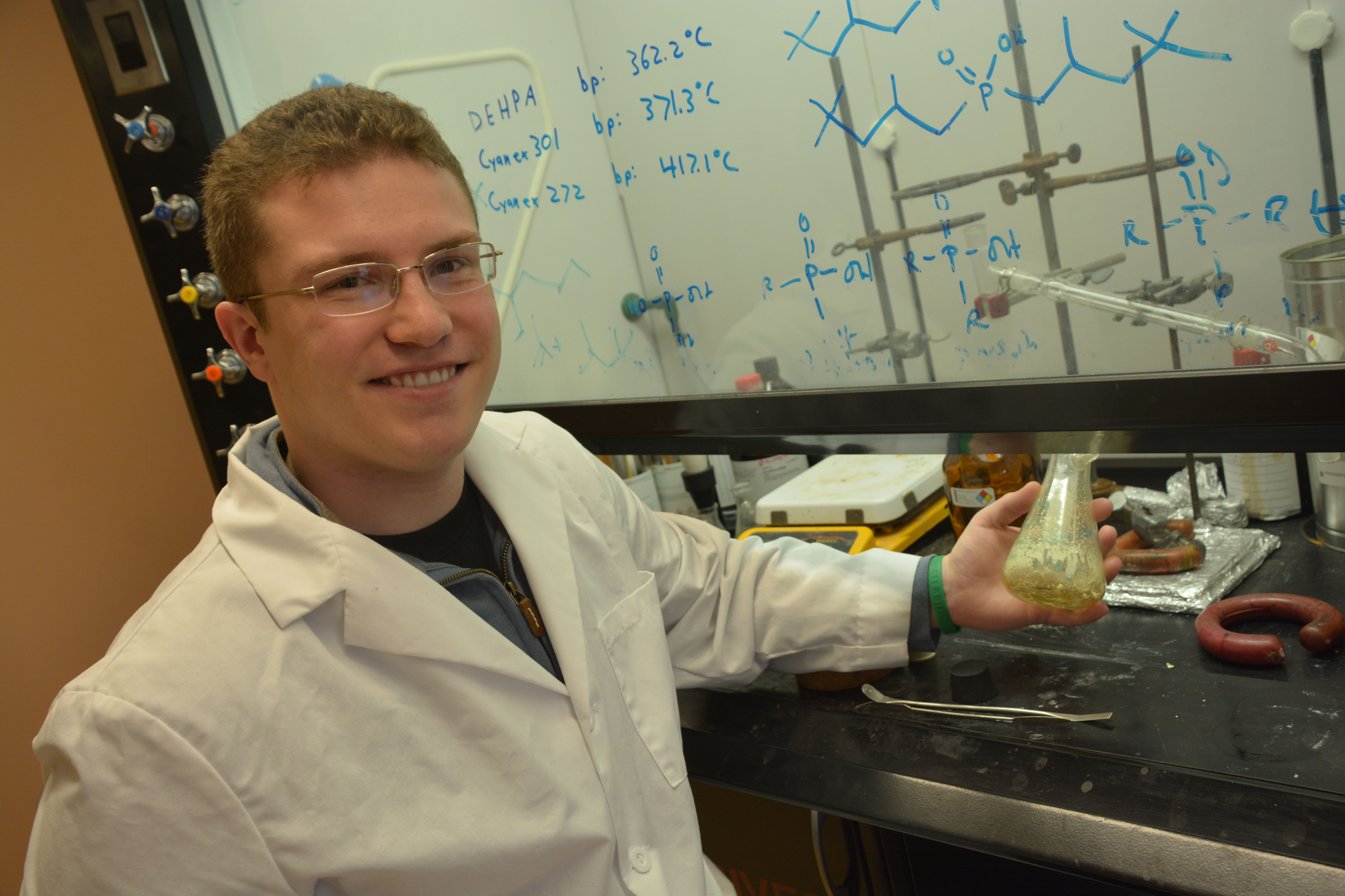 Jesse Hinricher extracts rare earth elements from ores in a chemistry lab at the South Dakota School of Mines & Technology.