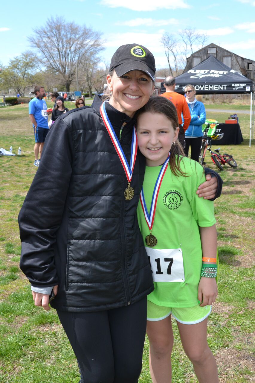 Trumbull's Rose Hopwood, 9, shown here with Betsy Hopwood, took home first place 5k honors in her division.